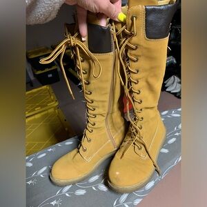 Tan Lace-Up Boots construction look. In loved used condition. Flaw on left toe